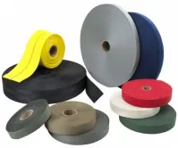 Multiple rolls of flat webbing material in several colors