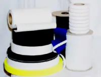 Multiple rolls of clothing elastic stacked on top of each other in several colors